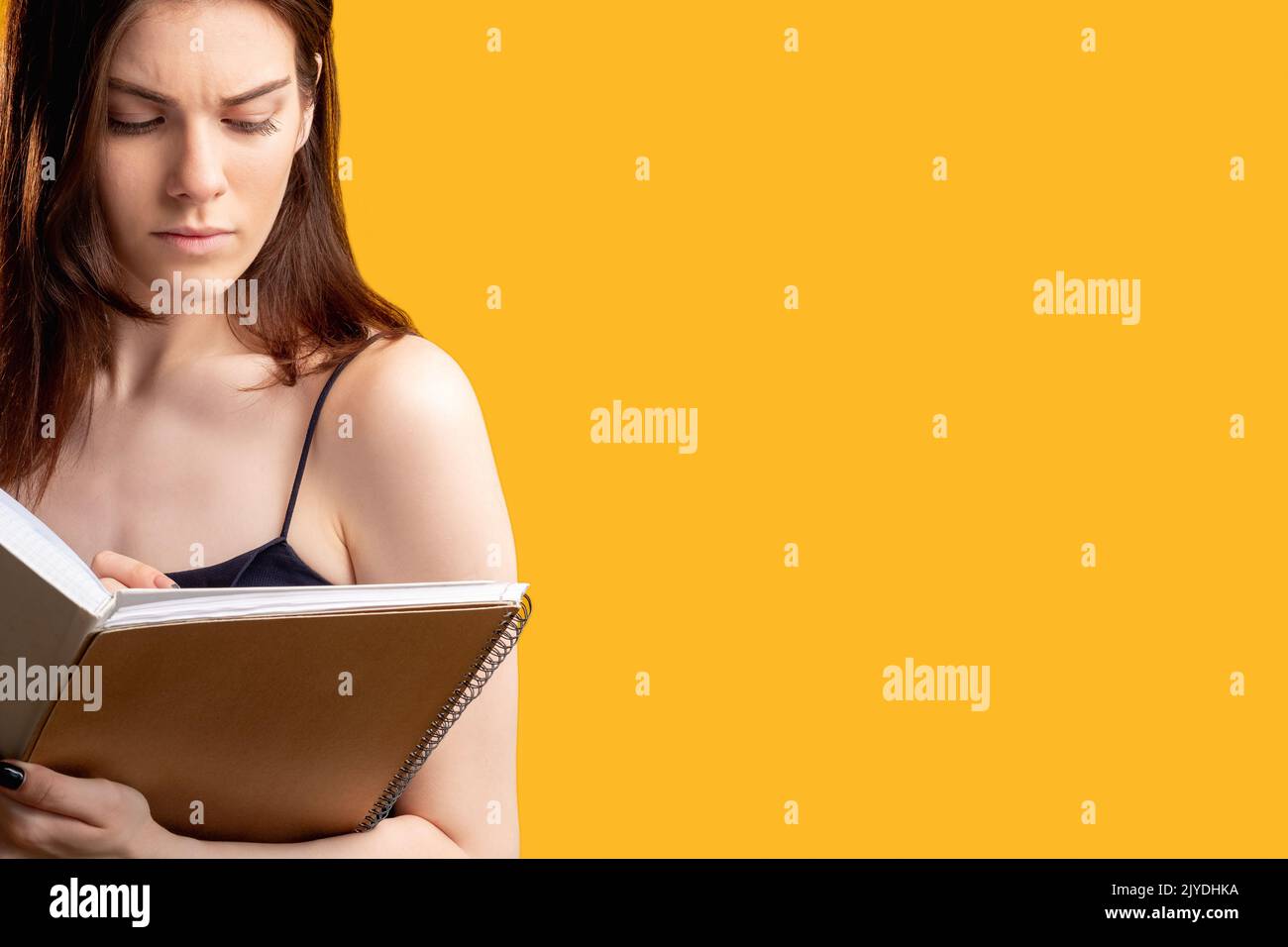 making notes thoughtful woman writing notebook Stock Photo