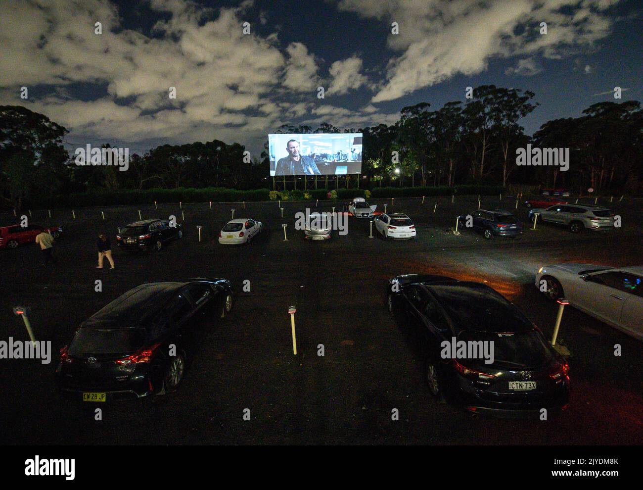 Cinema goers watching a film from their car at the 