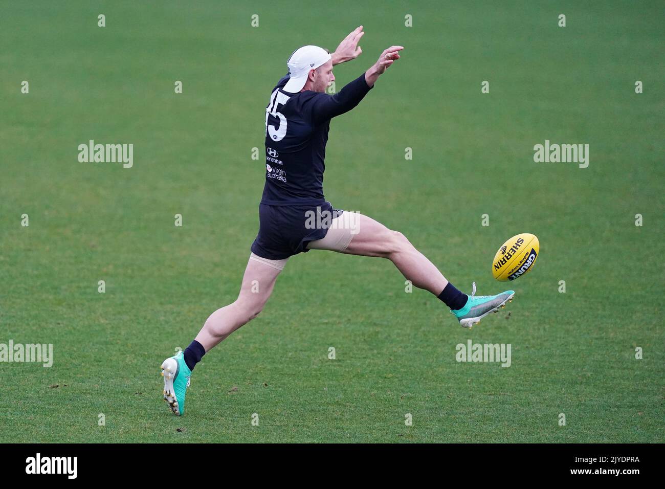 Sam Docherty of the Blues kicks the ball during and AFL Carlton Blue ...