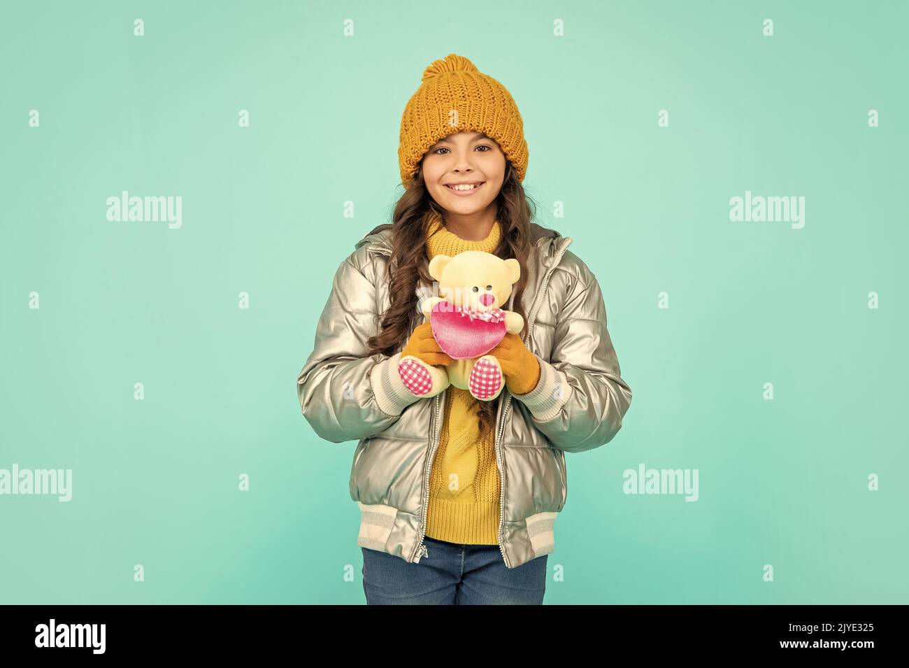 express positive emotion. winter fashion. love toy for valentines day. glad kid Stock Photo