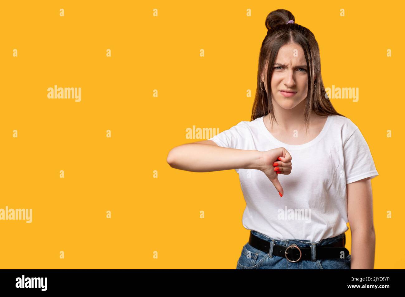 dislike gesture bad job sad woman thumb down Stock Photo
