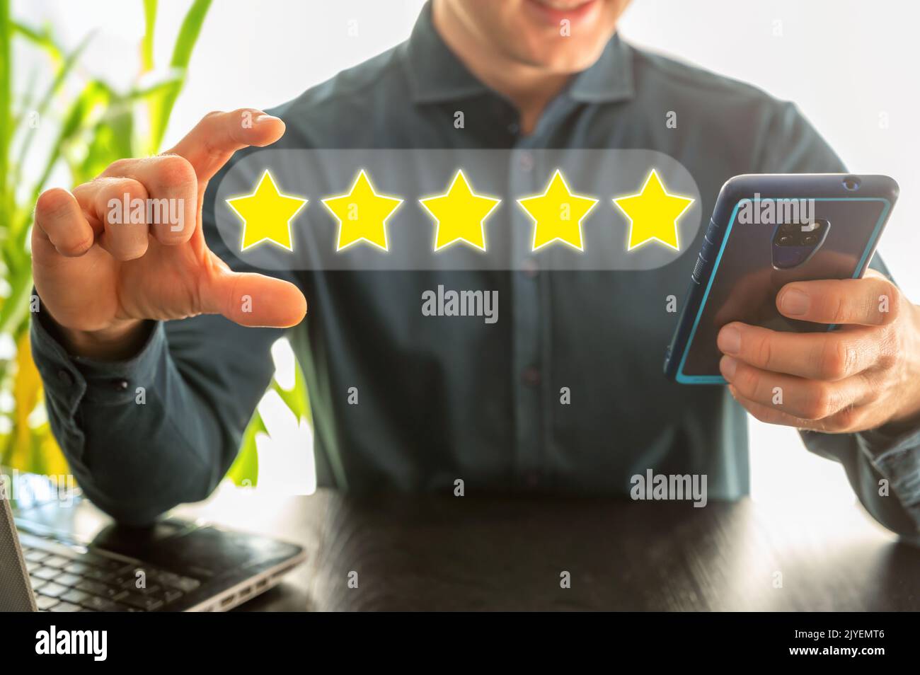 Satisfied customers rate the product or service online with five stars Stock Photo