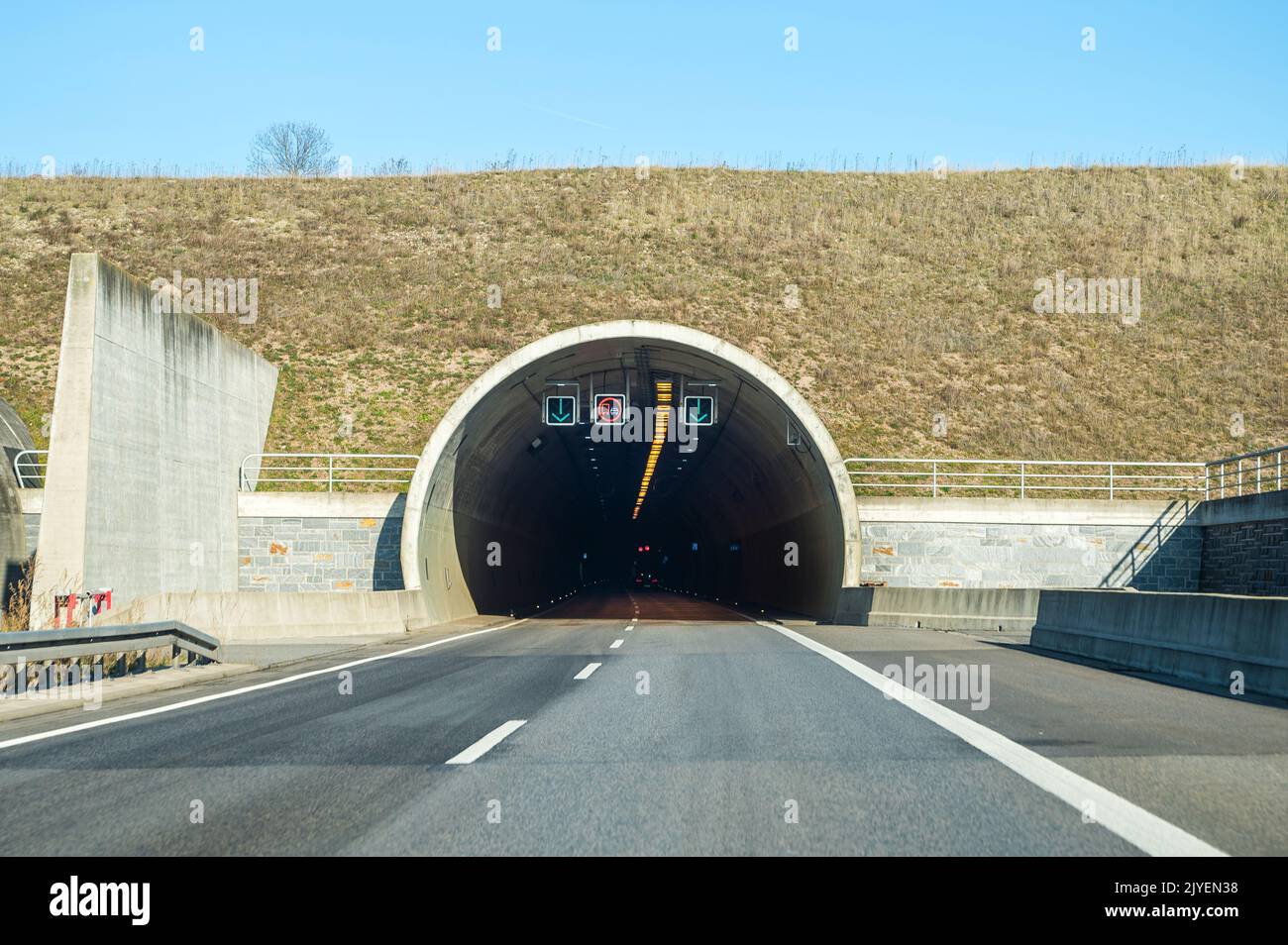 Entry to a large and long tunnel on a highway Stock Photo