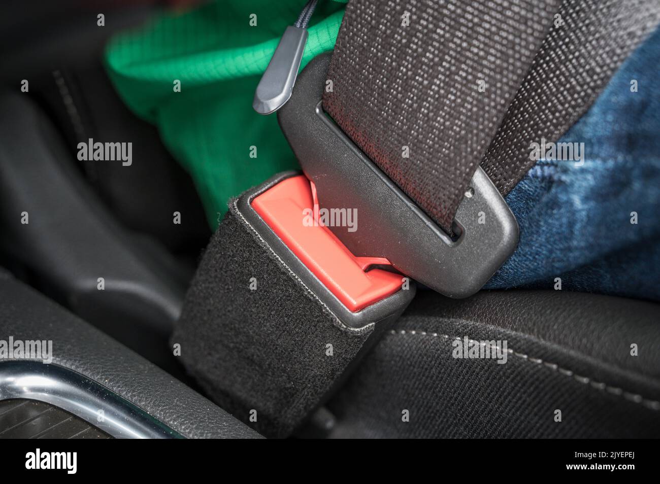 The seat belt buckle and tongue of a seat belt in a car as a symbol for seat belt use Stock Photo