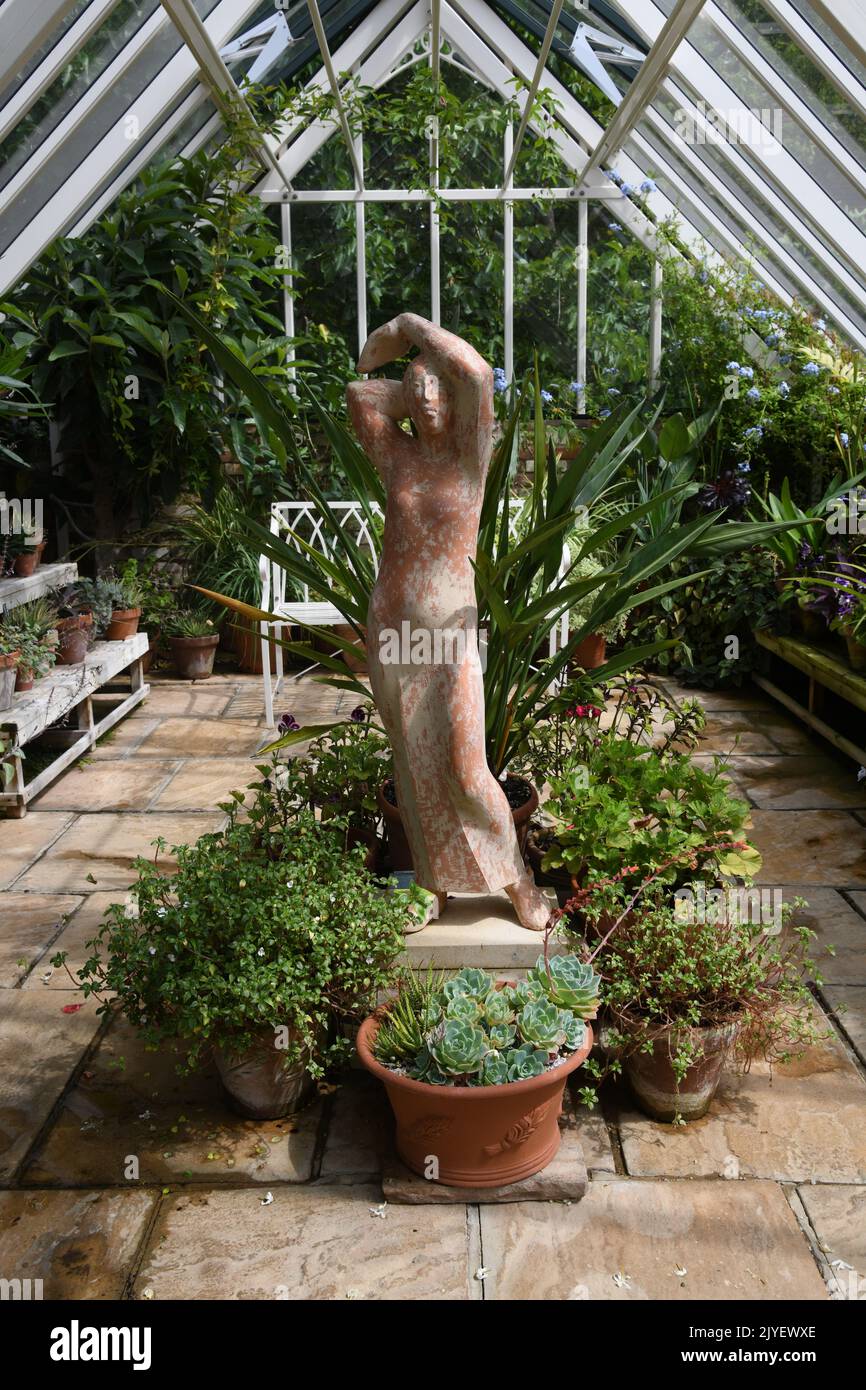 Greenhouse with terracotta statue Stock Photo