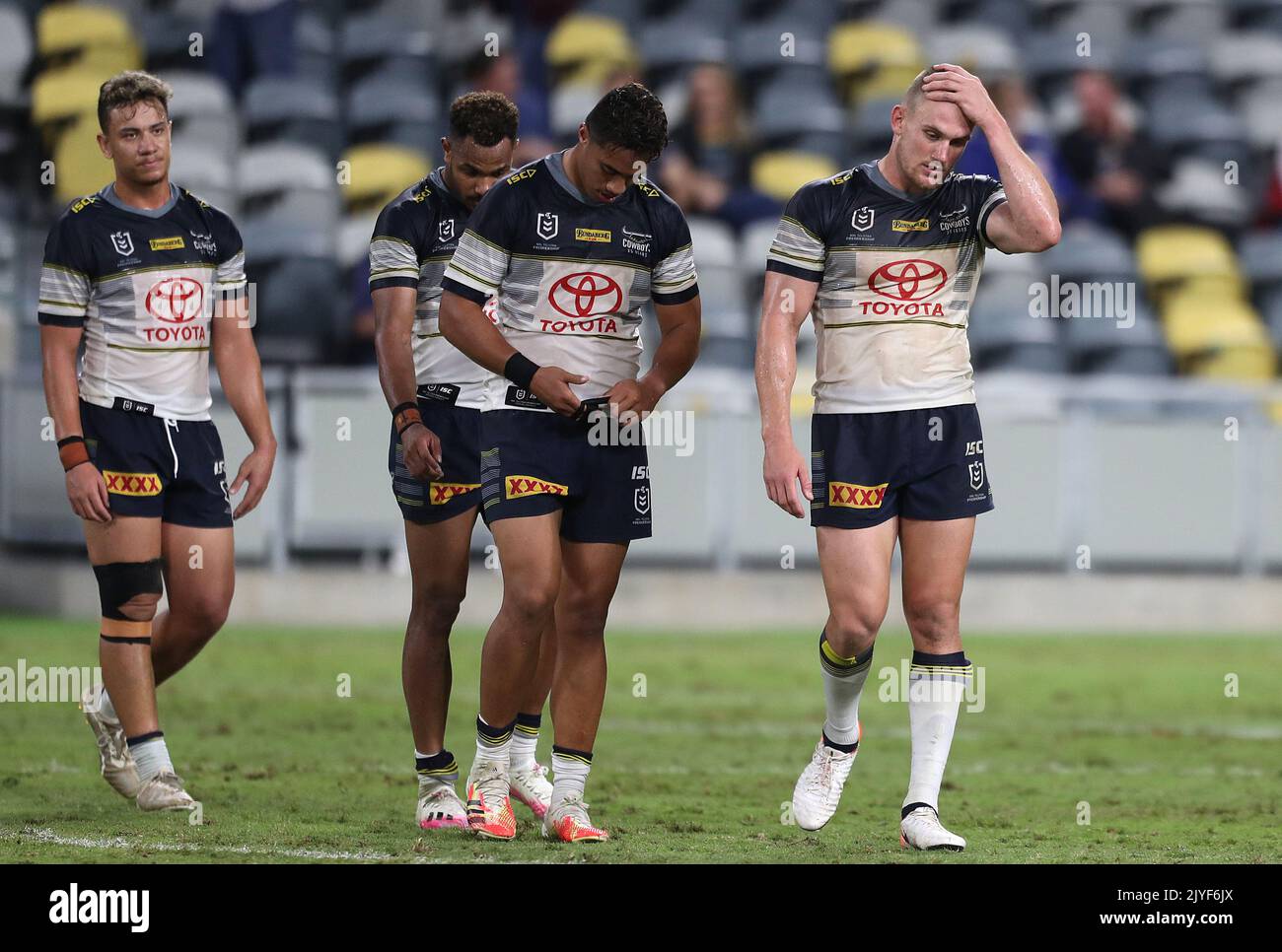 Cowboys players react following the Round 11 NRL match between North