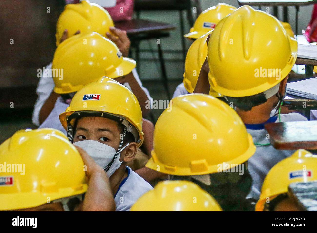 Manila, Philippines. 8th Sep, 2022. Students wearing hard hats