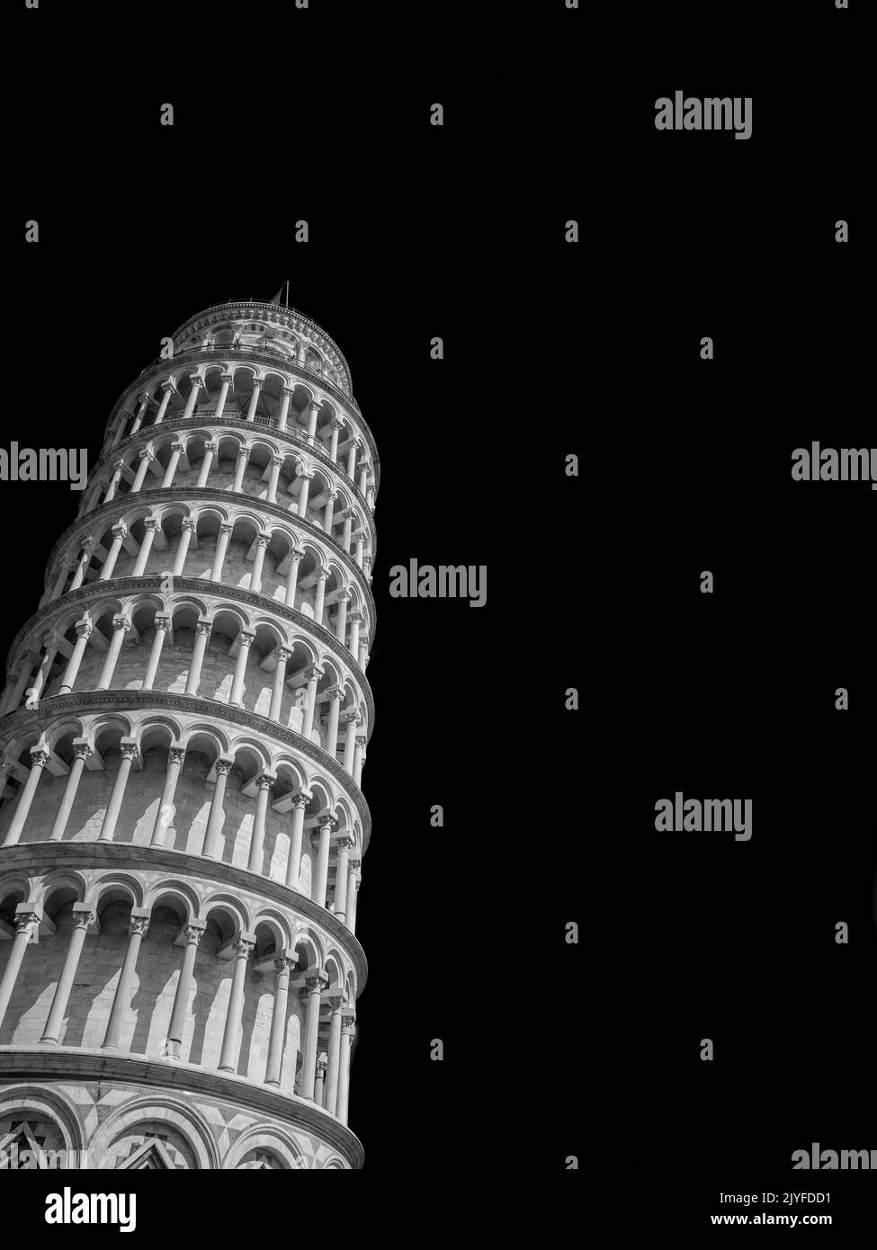 The iconic Leaning Tower of Pisa, one of the most famous ancient building in the world, seen from below (Black and White with copy space) Stock Photo