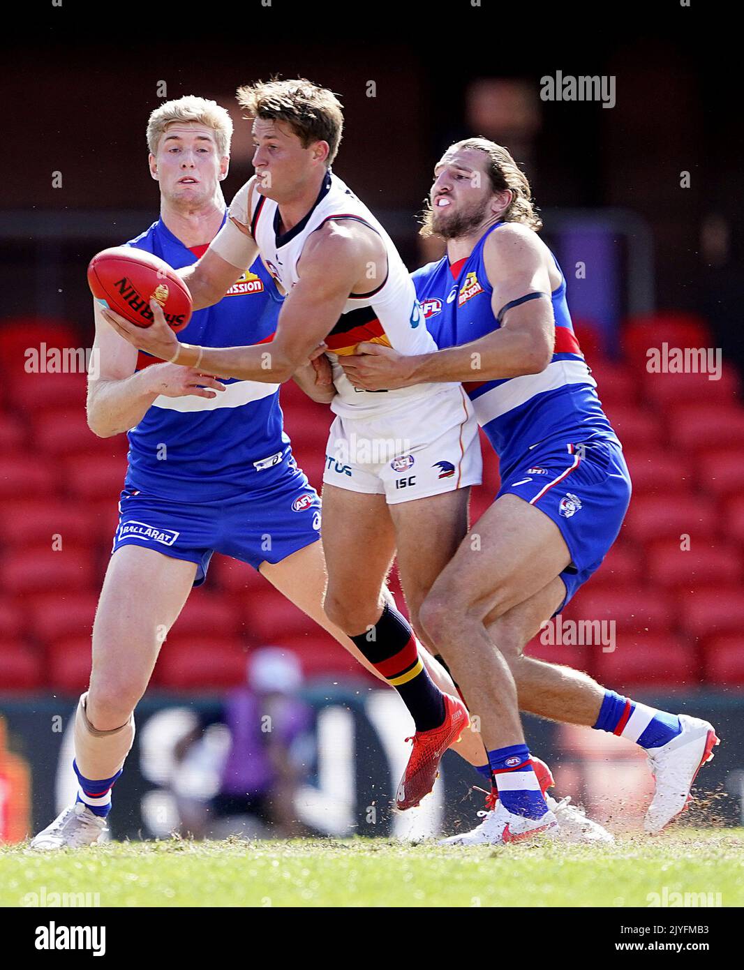 Marcus Bontempelli of the Bulldogs tackles Matt Crouch of the Crows ...