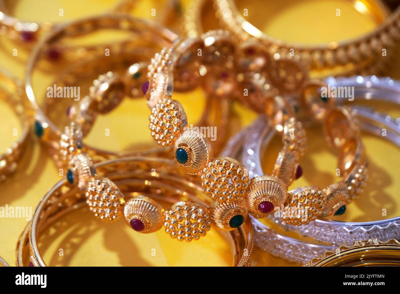 26 September 2022, Pune , India, Colorful Bangles display in Shop for women, Metal Bangles Arranged On The Shelf For Sell, Series of bangles. Stock Photo