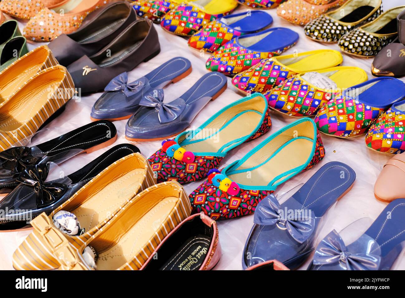 Colorful Handmade chappals (sandals) being sold in an Indian market, Handmade leather slippers, Traditional footwear. Stock Photo
