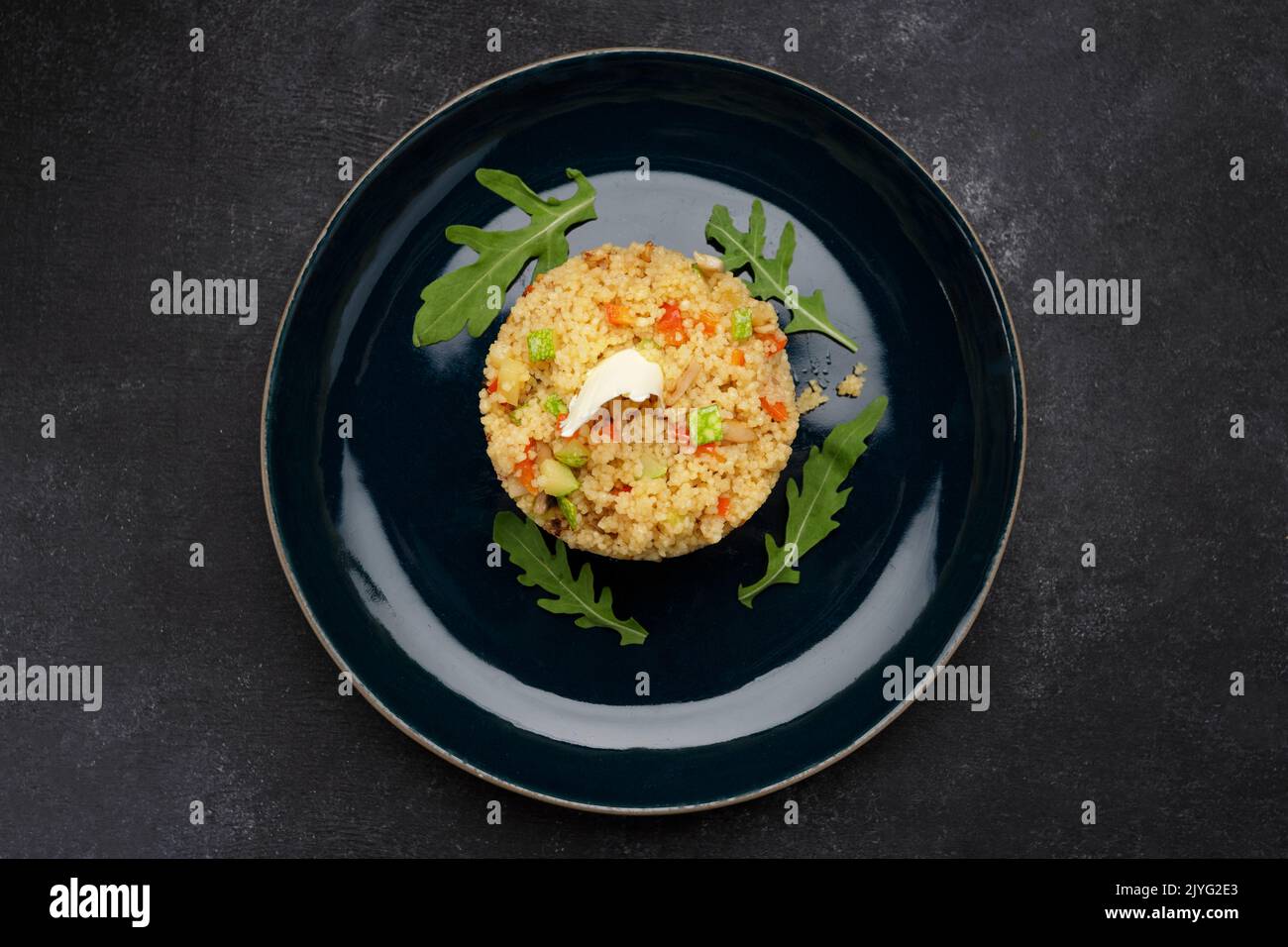 Couscous porridge with vegetables, butter and herbs Stock Photo Alamy