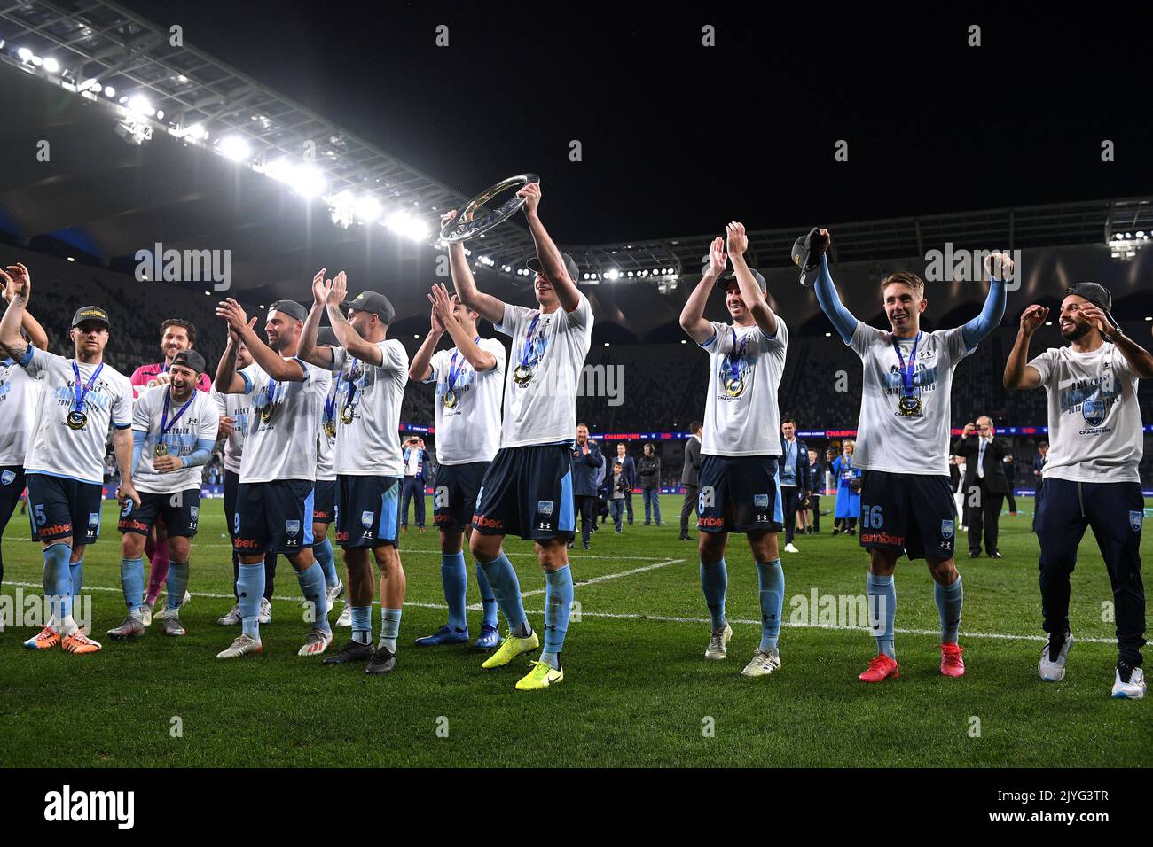 Alex Wilkinson (centre) and teammates celebrate after winning the A ...