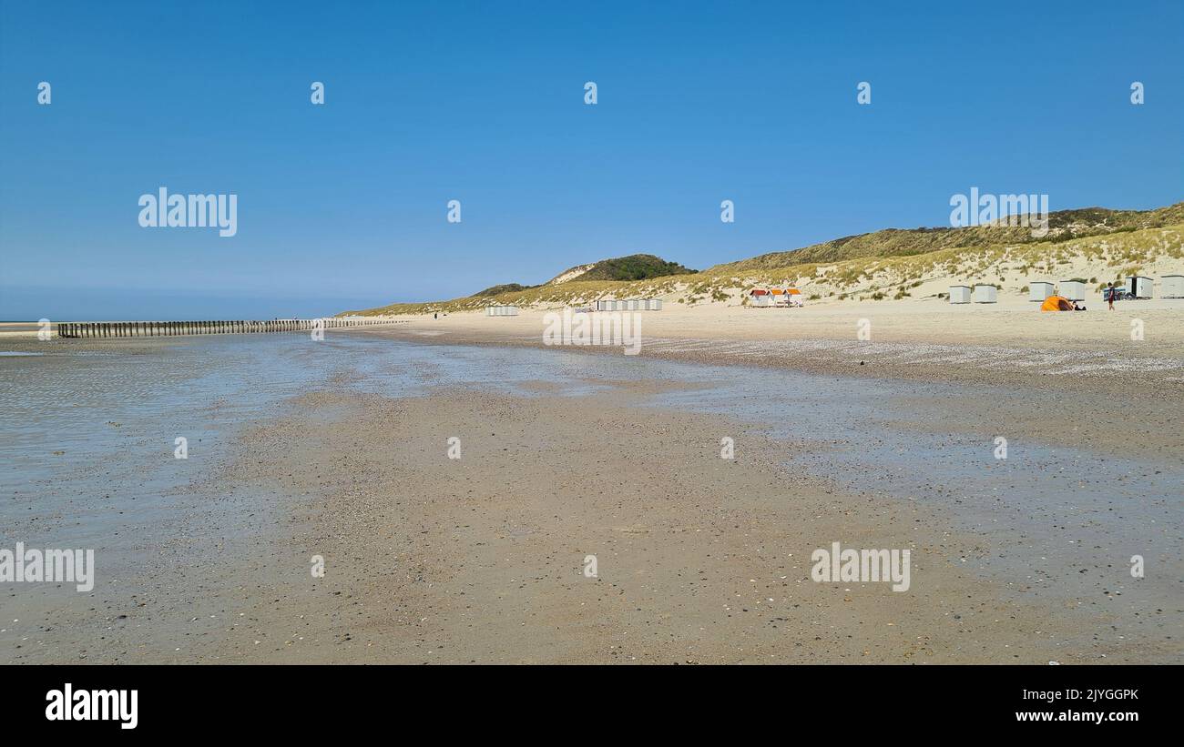 View over the sea from the dune over North Sea and canal in Ouddorp, Zeeland province, The Netherlands. Outdoor scene of coast in Europe nature. Stock Photo