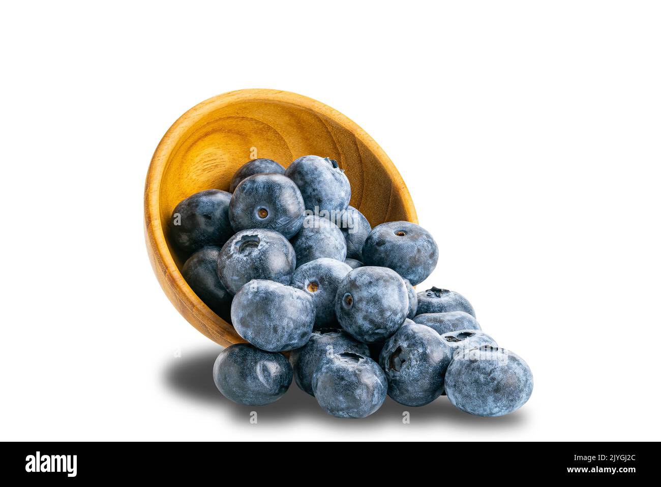 Pile of fresh blueberry in wooden bowl isolated on white background with clipping path. Stock Photo