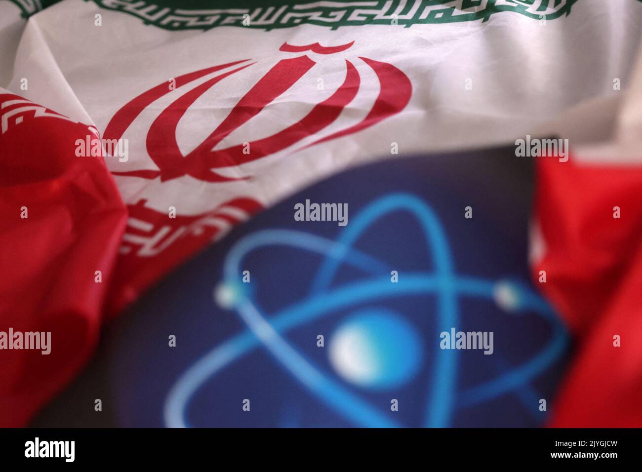 Atomic symbol and Iranian flag are seen in this illustration taken September 8, 2022. REUTERS/Dado Ruvic/Illustration Stock Photo