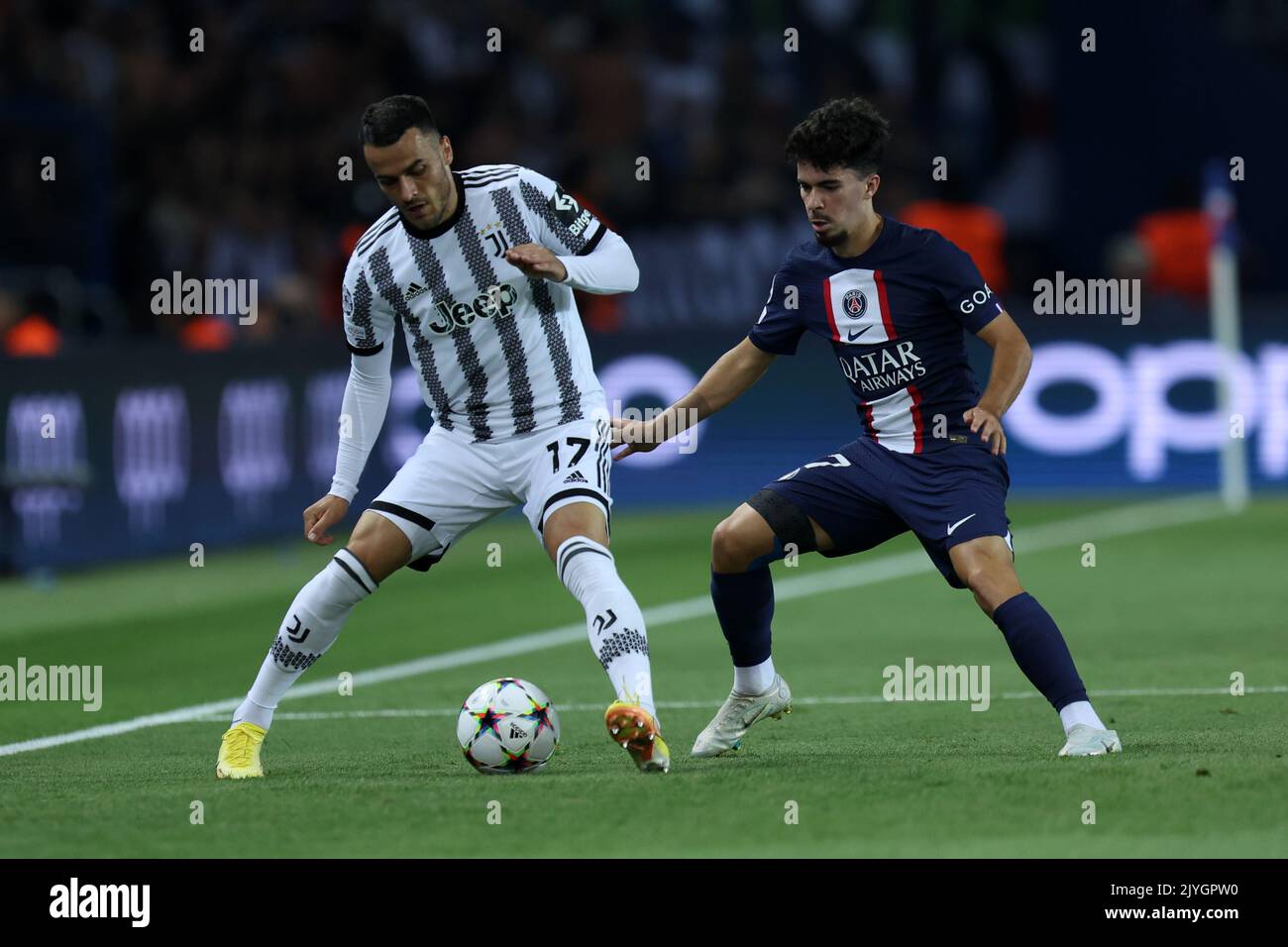Filip Kostic of Juventus Fc and Vitinha Machado pf Paris Saint-Germain Fc  battle for the ball during the  Uefa Champions League Group H match beetween Paris Saint Germain Fc and Juventus Fc at Parc des Princes on September 6, 2022 in Paris, France . Stock Photo