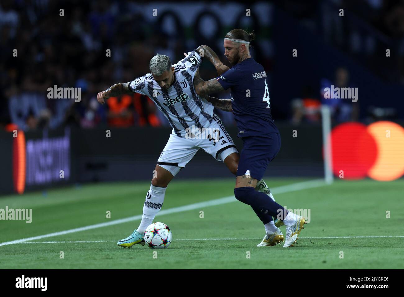 Leando Paredes of Juventus Fc and Sergio Ramos pf Paris Saint-Germain Fc  battle for the ball during the  Uefa Champions League Group H match beetween Paris Saint Germain Fc and Juventus Fc at Parc des Princes on September 6, 2022 in Paris, France . Stock Photo