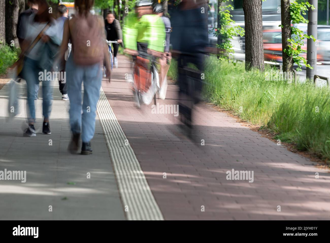 pedestrians and cyclists with motion blur Stock Photo