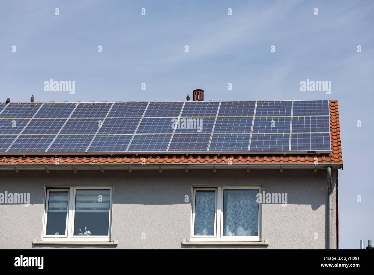 solar power plant on the roof of apartment building Stock Photo