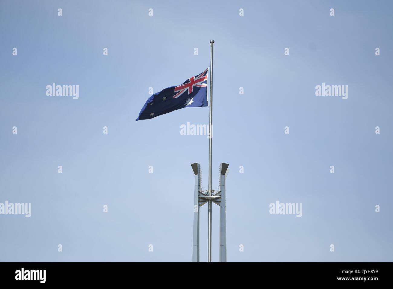 The Australian flag is seen flying at halfmast at Parliament House in