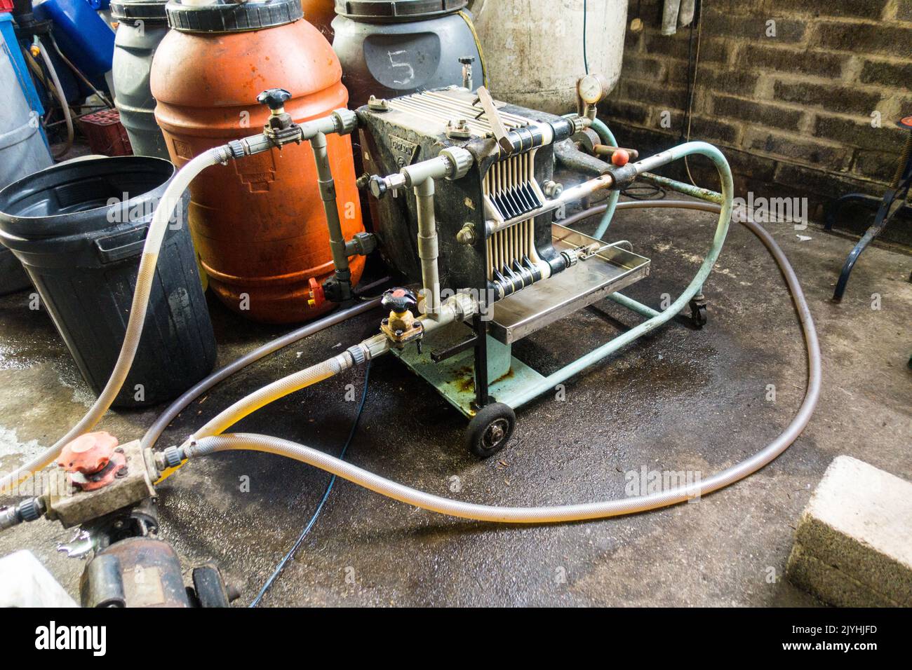Wine Filter Press in Vinyard clearing and filtering wine, England, UK