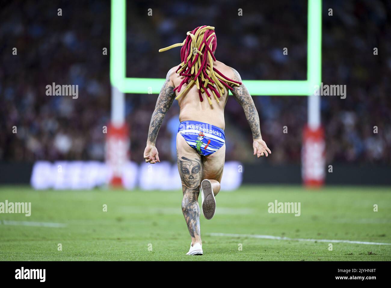 A pitch invader runs onto the pitch during Game 3 of the 2020 State of Origin series between the A pitch invader runs onto the pitch during Game 3 of the 2020 State of Origin series between the