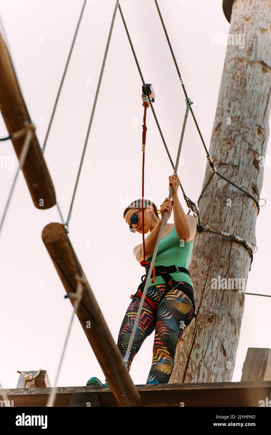 Pro climber getting ready to conquer the climbing course Stock Photo
