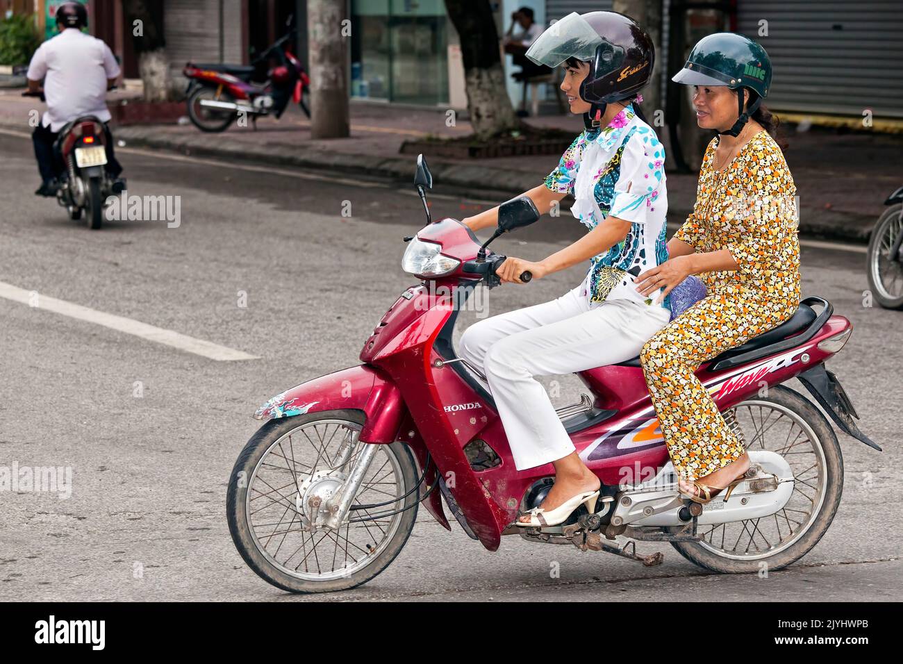 Motorbike in traffic, Hai Phong, Vietnam Stock Photo