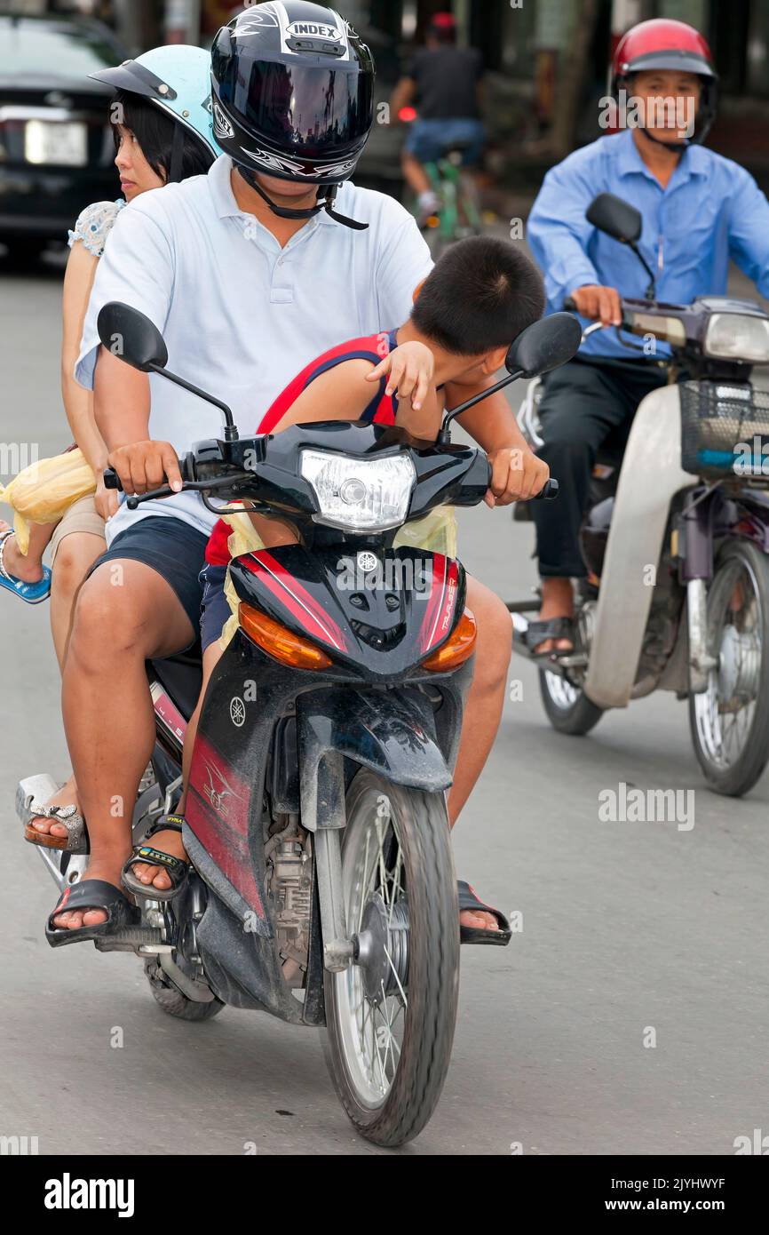 Motorbike in traffic, Hai Phong, Vietnam Stock Photo