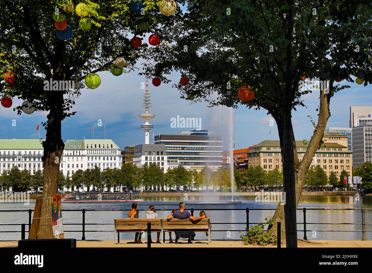 Trees at the Ballindamm at the Inner Alster are decorated with lampions during the event 'Hamburg Summer Gardens', Germany, Hamburg Stock Photo