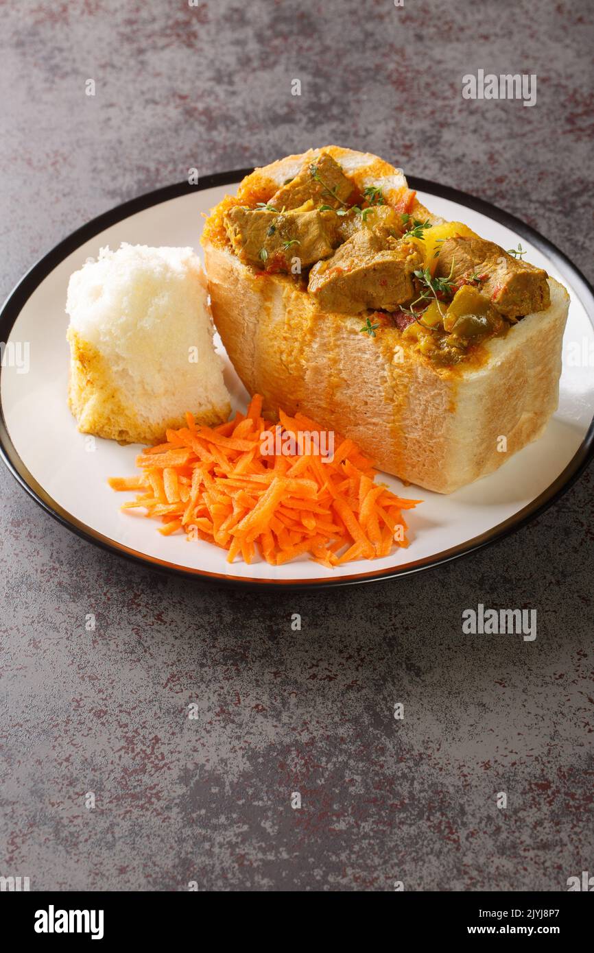 Durban Bunny Chow or a quarter mutton bunny consisting of a section of a loaf of bread hollowed