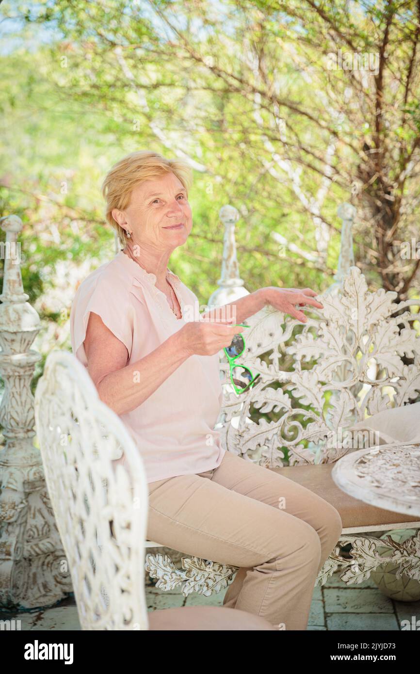 Mature woman alone walking park hi-res stock photography and images - Alamy