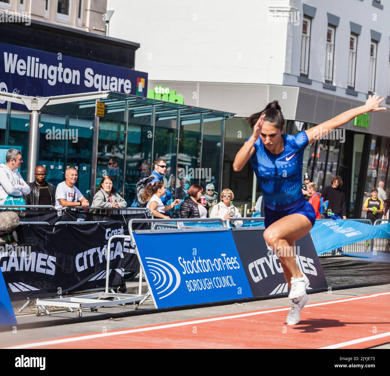 The Great North City Games were held in the High Street ,Stockton on Tees,England,UK. A  female long jumper sets off on her run up. Stock Photo