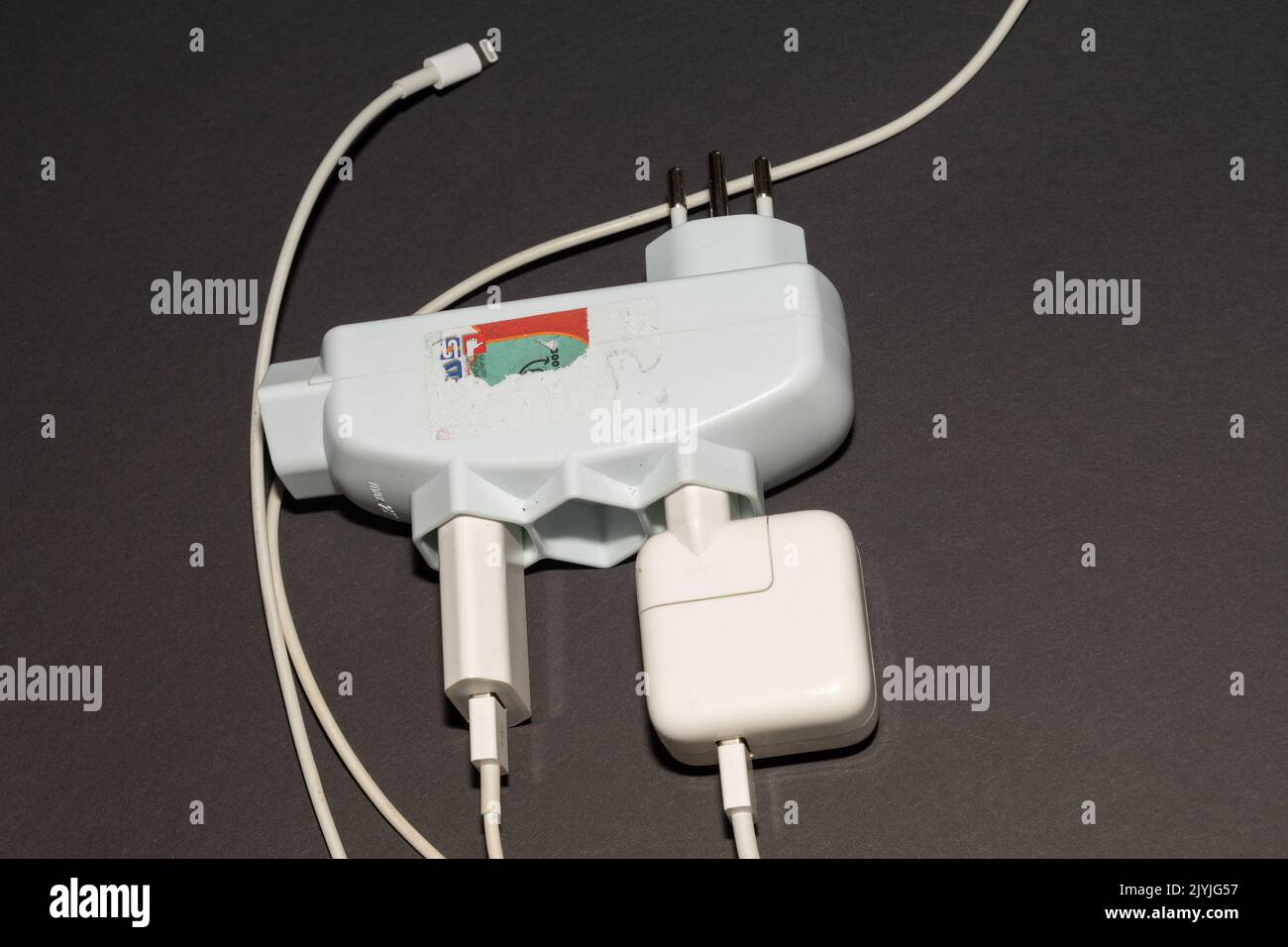 Vaduz, Liechtenstein, September 6, 2022 Electric power plug put in a socket to generate electricity in an apartment Stock Photo