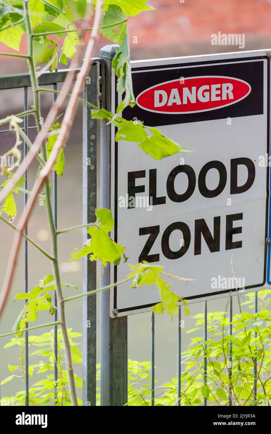 A Flood Zone sign beside the 1891 built, Hawthorne Canal that flows into Sydney Harbour via the Parramatta River in Australia Stock Photo