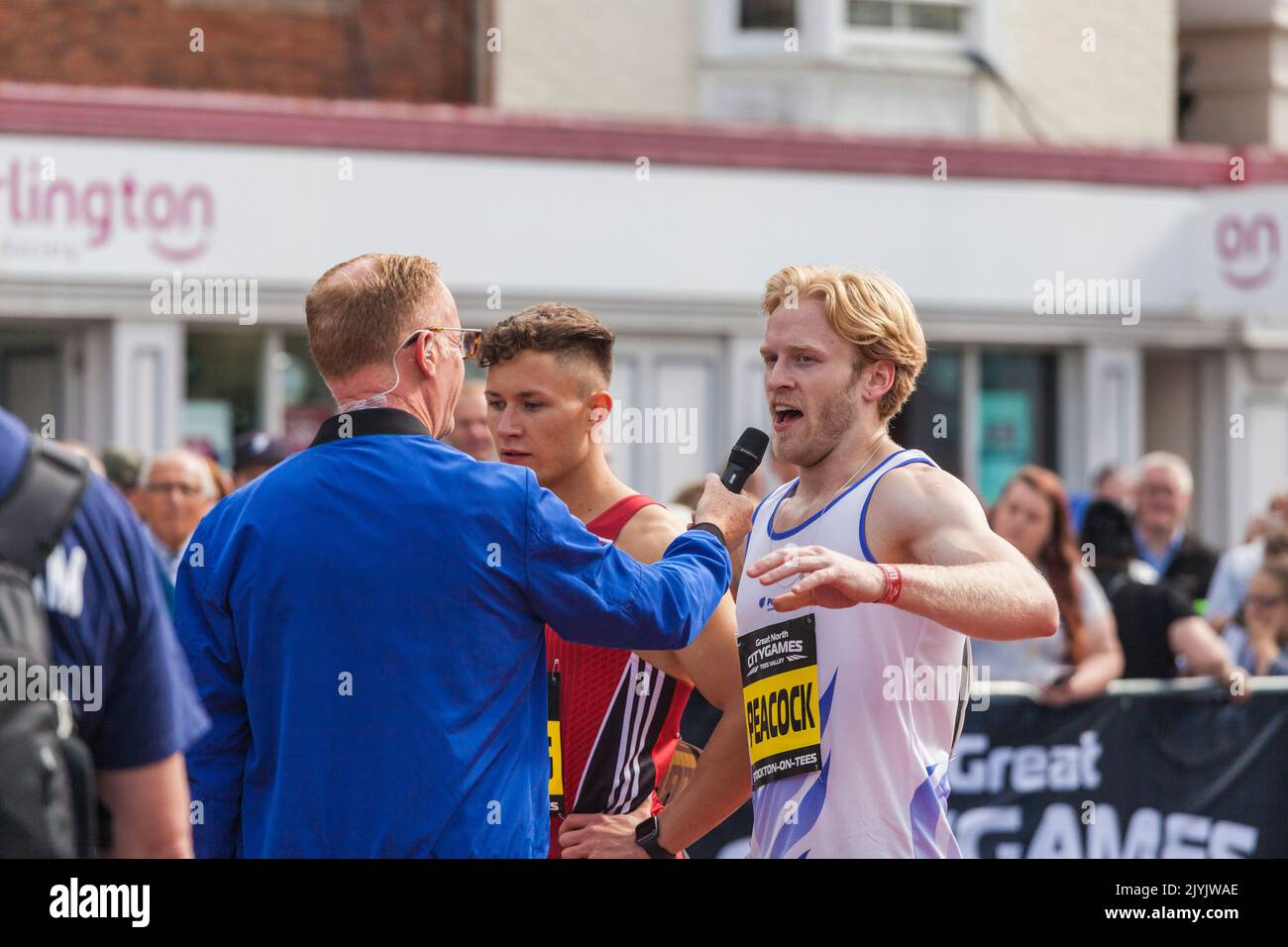 Jonnie Peacock and the other sprinters at the end of their race in the Great North City Games which were held in the High Street,Stockton on Tees,UK Stock Photo