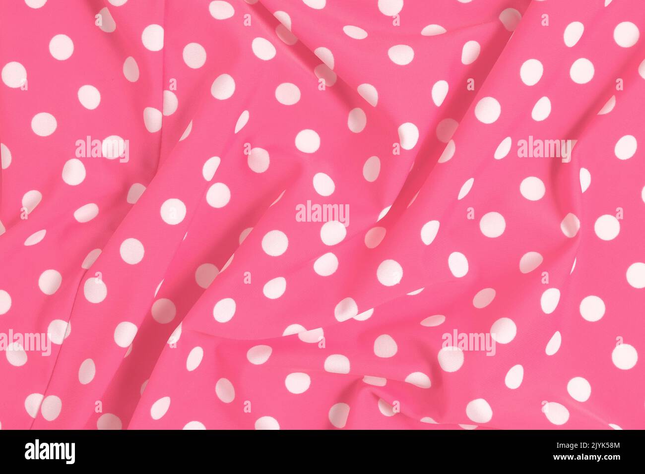 Pink polka dot fabric swatch background ruffled Stock Photo