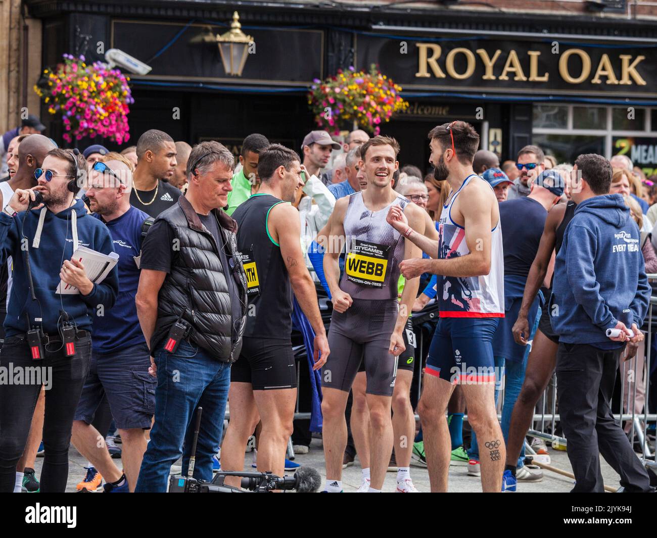 The Great North City Games were held in the High Street ,Stockton and the sprint runners chat and congratulate each other at the end of their race Stock Photo