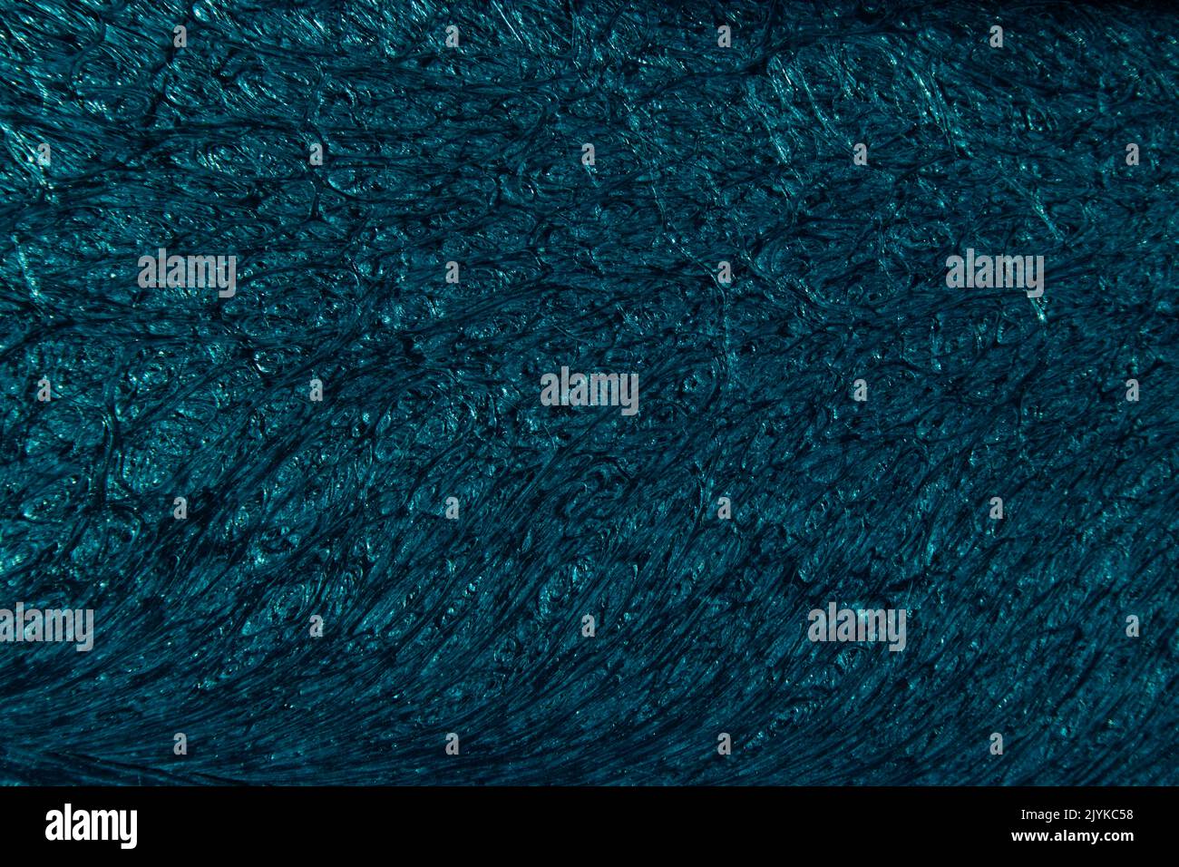 Petrol colored background with wavy textures of different shades of dark teal Stock Photo