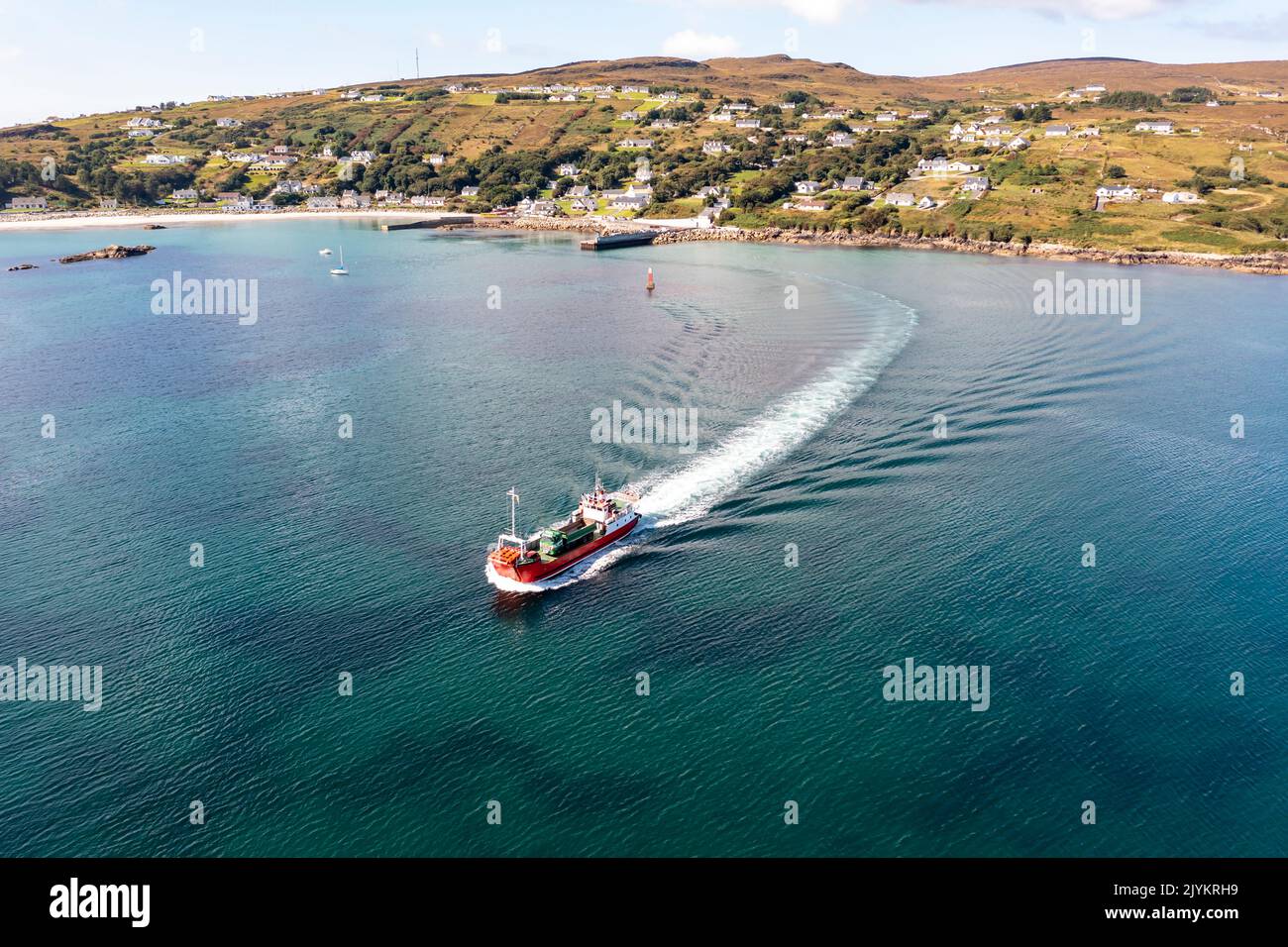 The red Arranmore ferry leaving the Island towards Burtonport, County Donegal, Ireland. Stock Photo