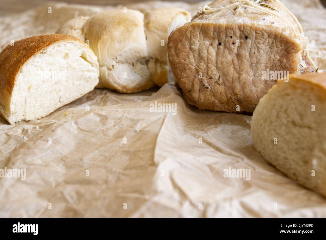 pork loin accompanied by slices of bread Stock Photo