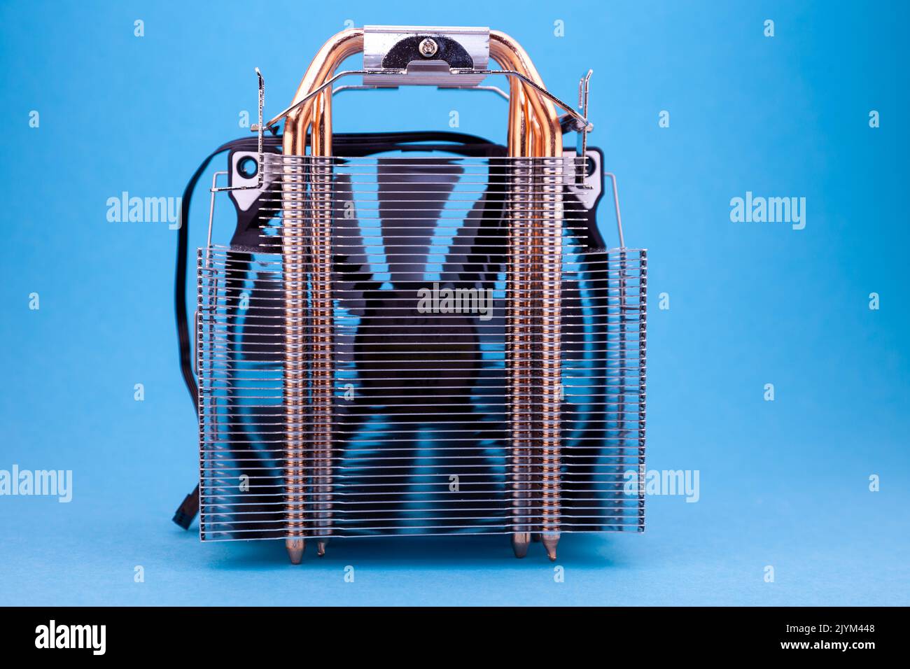 Computer heatsink cooler on blue background. Detail of a personal