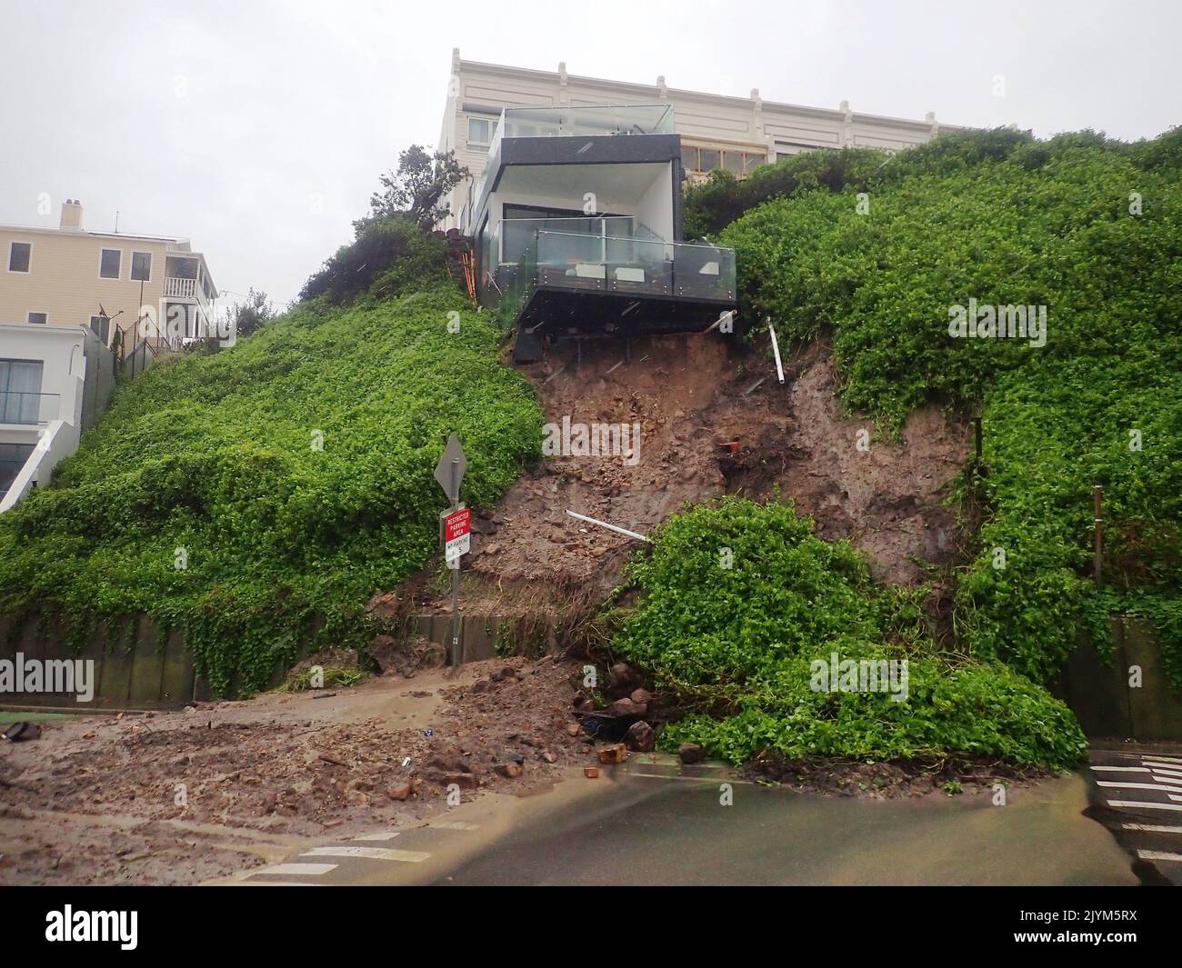 A House Is Seen After A Landslip Took Out Some Of Its Foundations a-house-is-seen-after-a-landslip-took-out-some-of-its-foundations