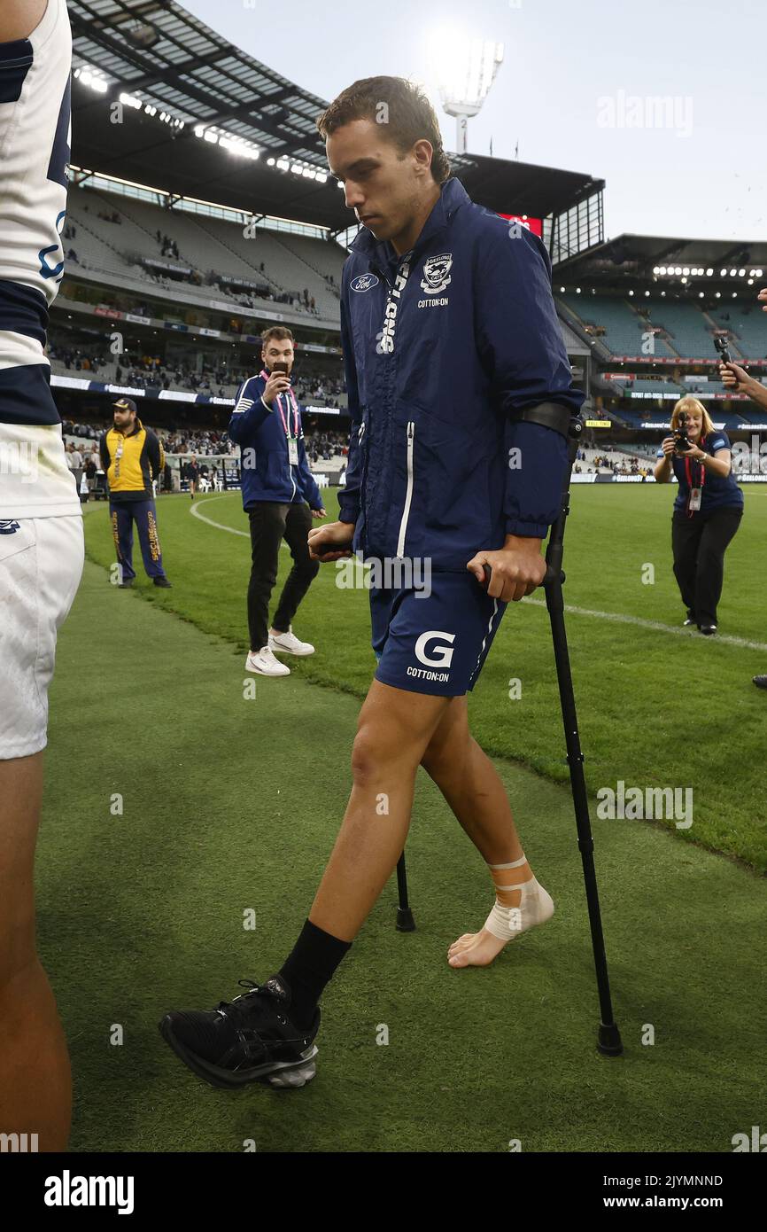Francis Evans of the Cats is seen on crutches after sustaining an ...