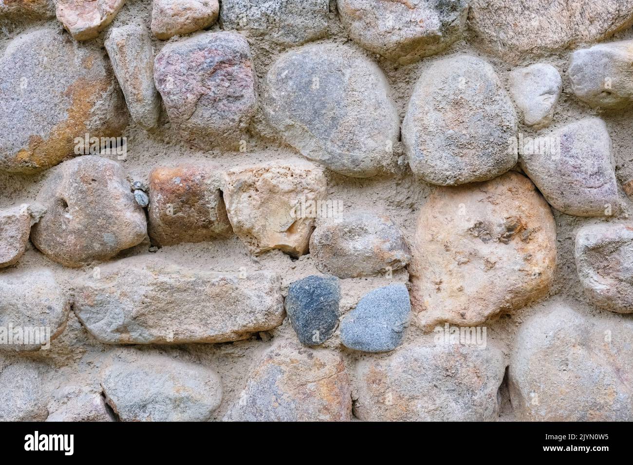Natural stone wall. Abstract stone texture. Closeup. Stock Photo