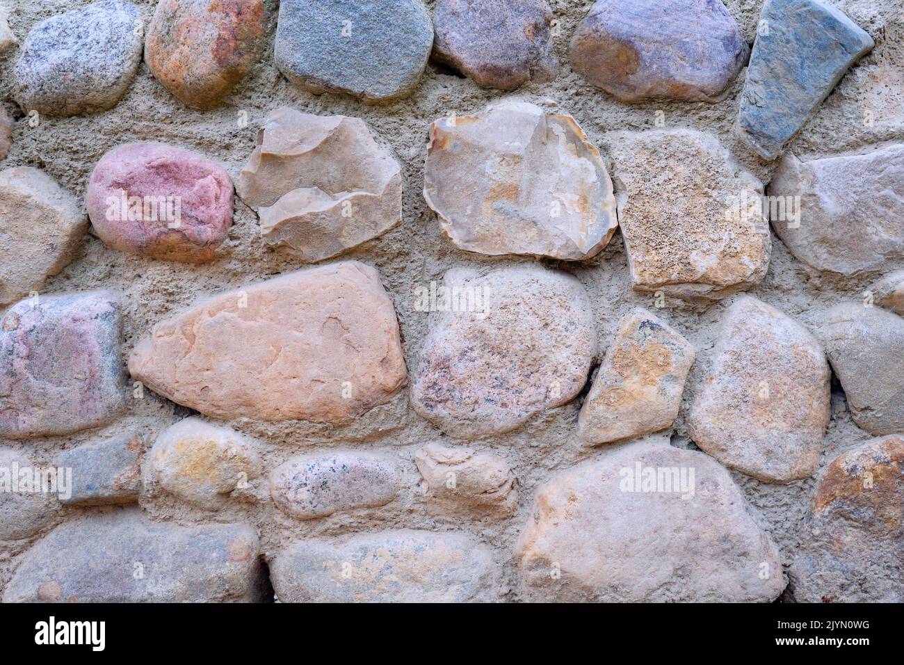 Natural stone wall. Abstract stone texture. Closeup. Stock Photo