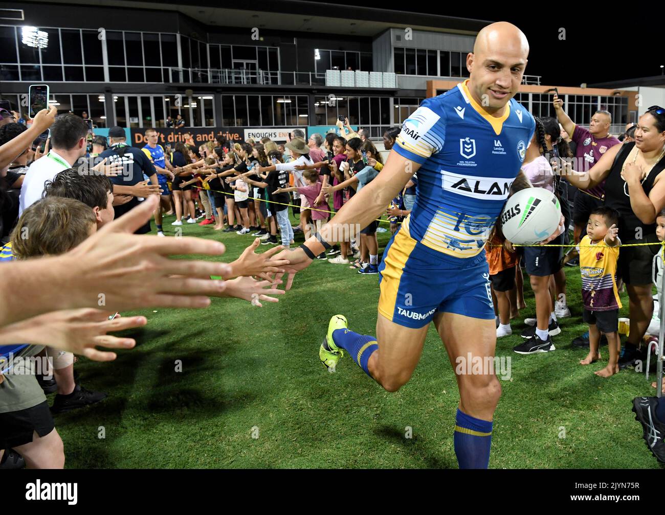 Blake Ferguson (centre) of the Eels is seen running onto the field