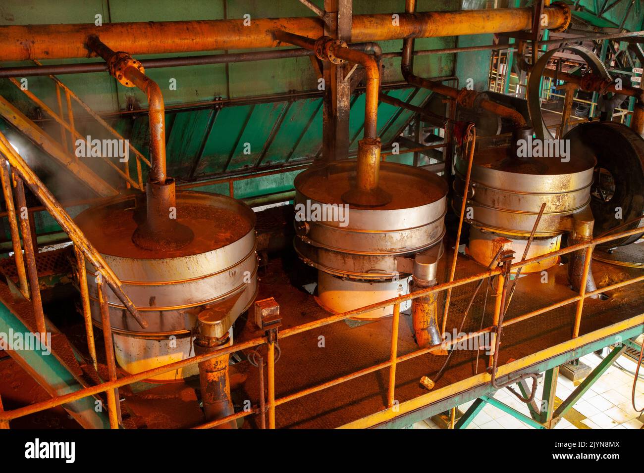 Crude palm oil extraction in processing factory, West Kalimantan, Indonesia Stock Photo