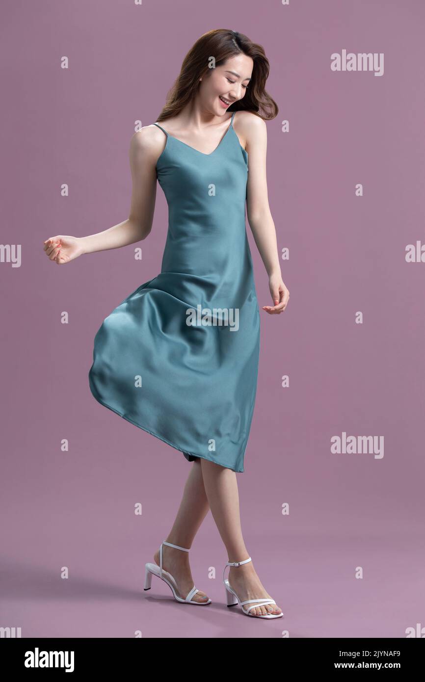 Studio shot of beautiful young Chinese woman Stock Photo - Alamy